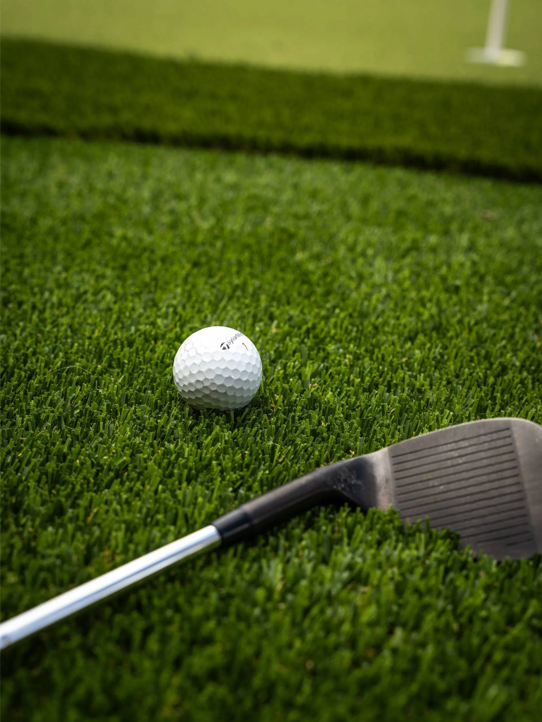 A custom putting greens setup in Chandler, AZ installed beside desert plantings