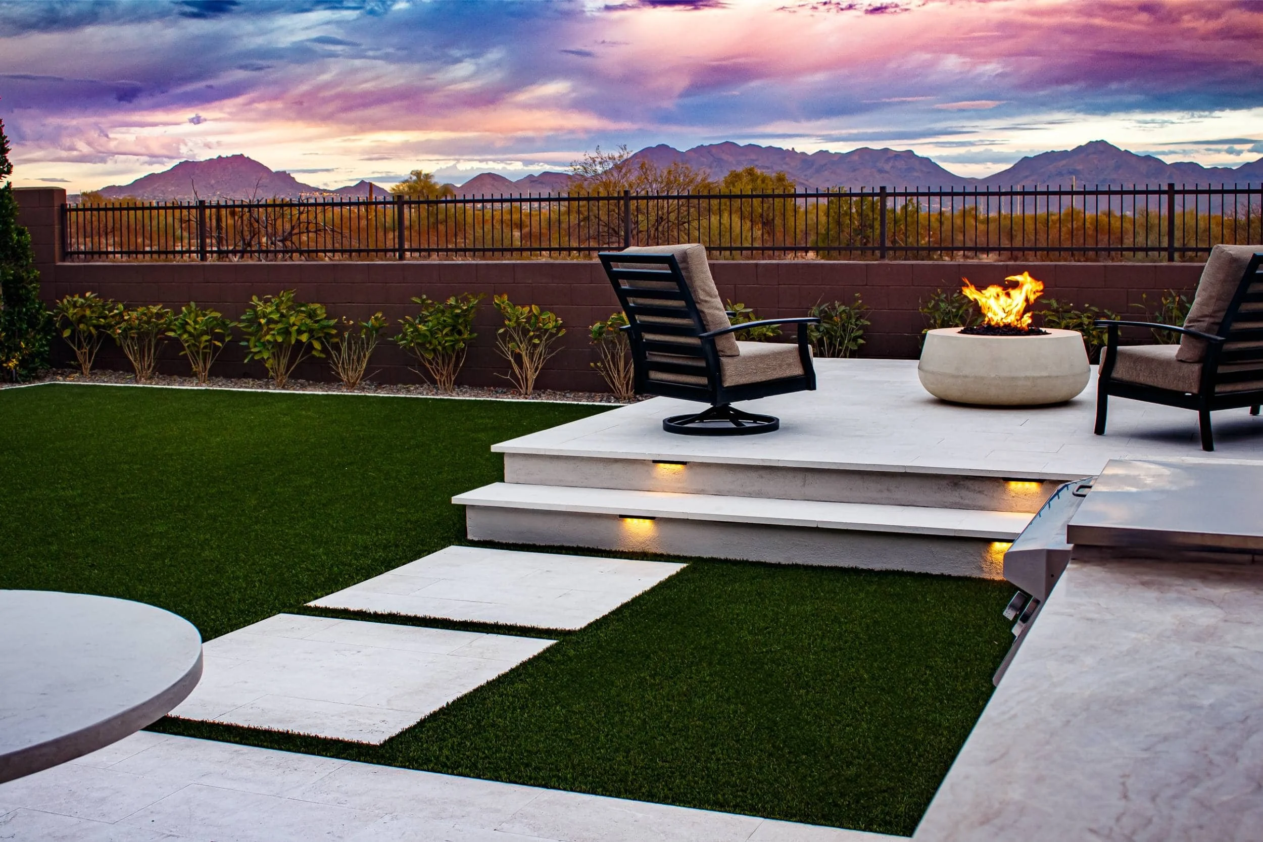 A backyard in Scottsdale, AZ showcasing landscape design with polished paver pathways