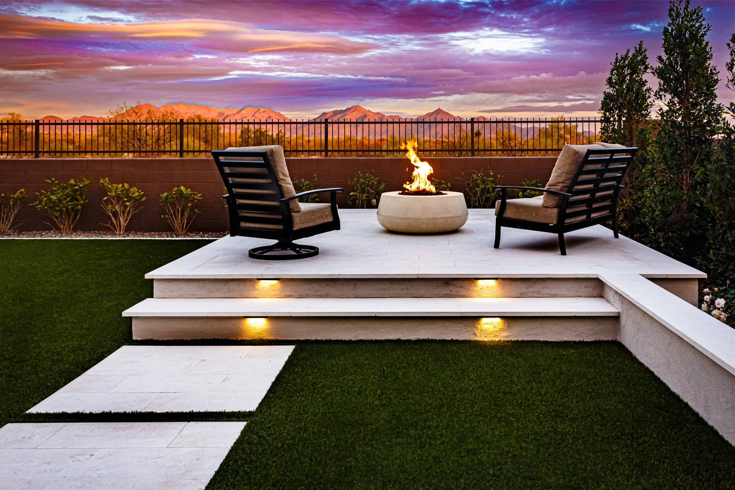 An outdoor lighting layout in Chandler, AZ illuminating a backyard seating area at dusk